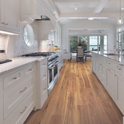 wood look laminate flooring in a open concept kitchen